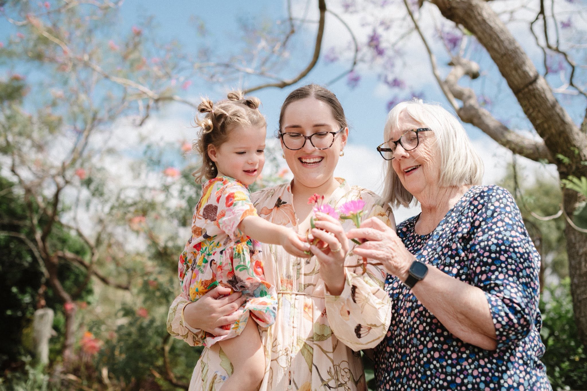 Three generations — a child, Emi, and her grandmother